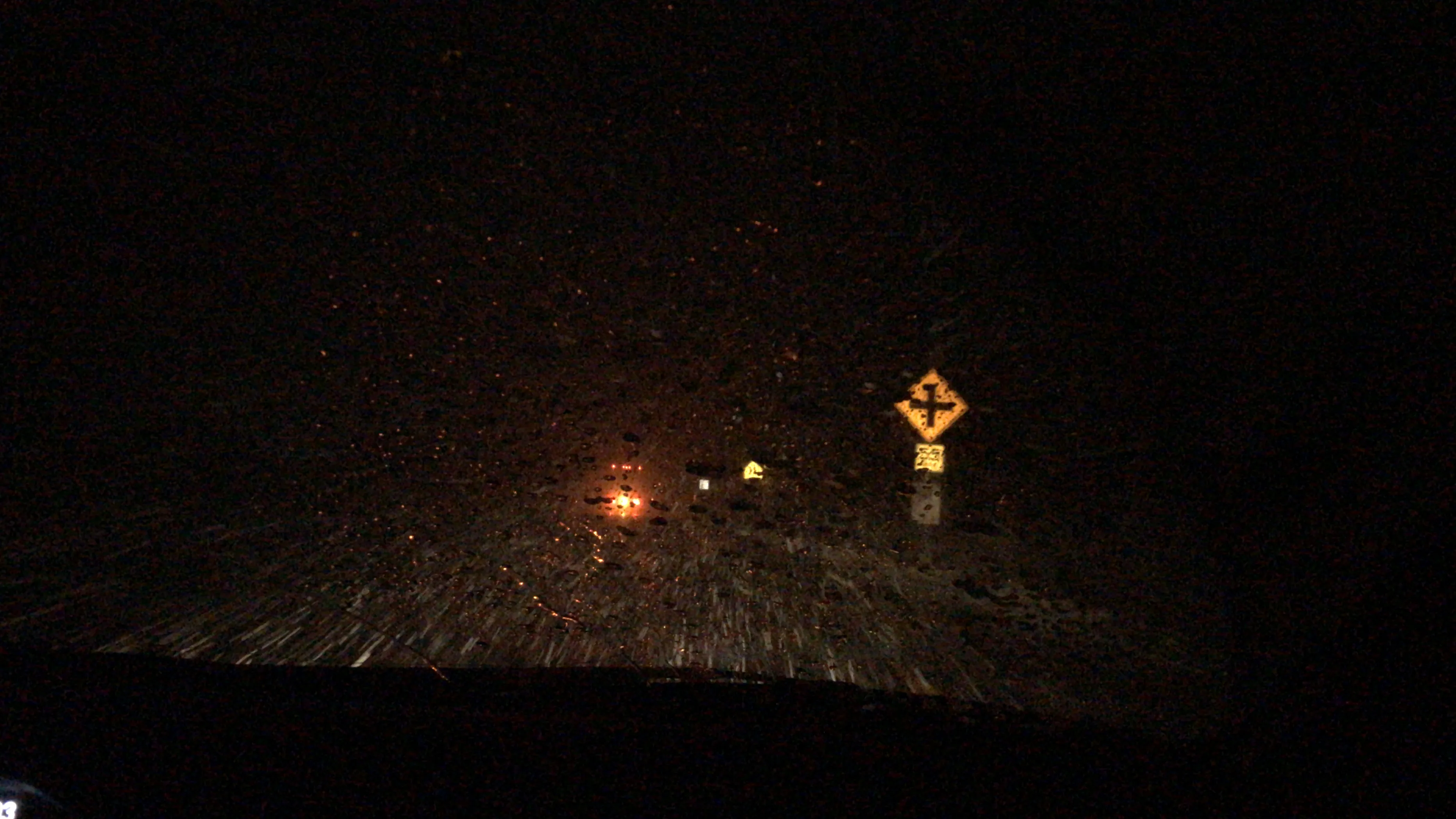 snowy road at night